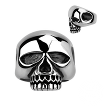 Load image into Gallery viewer, A silver-coloured ring with a large skull design on the top, resembling the style of the famous rock star Keith Richards.