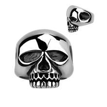 Load image into Gallery viewer, A silver-coloured ring with a large skull design on the top, resembling the style of the famous rock star Keith Richards.