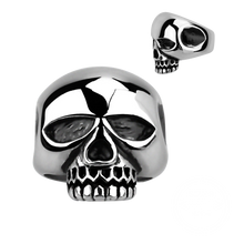 Load image into Gallery viewer, A silver-coloured ring with a large skull design on the top, resembling the style of the famous rock star Keith Richards.