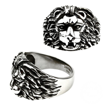 Load image into Gallery viewer, A stainless steel ring with a lion's face design, presented from two angles showing the profile and top view.