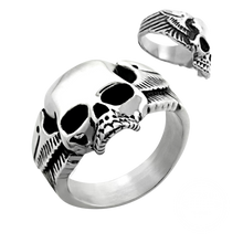 Load image into Gallery viewer, A high polished stainless steel ring with a skull and wings design, displayed from two different angles.