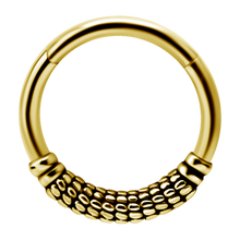 Load image into Gallery viewer, A single 24k gold PVD steel hinged ring with a patterned design, suitable for use as body piercing jewellery.
