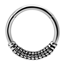 Load image into Gallery viewer, A single steel hinged ring with a patterned design, suitable for use as body piercing jewellery.