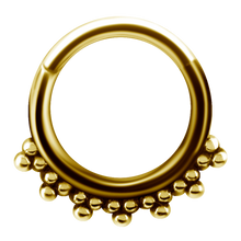 Load image into Gallery viewer, A 24k gold pvd tribal hinged ring with granulated details and a hinged center.
