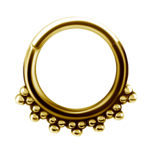Load image into Gallery viewer, A 24k gold PVD tribal hinged ring with granulated details and a hinged center.
