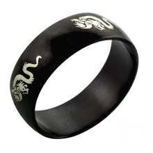 Load image into Gallery viewer, A black steel band ring with a engraved dragon design.
