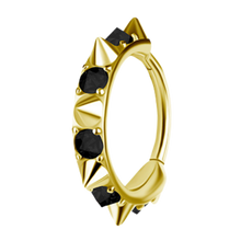 Load image into Gallery viewer, A gold-toned 18k Gold PVD cobalt chrome nickel free hinged ring decorated with multiple sharp conical spikes and clear upside down gemstones, shown on a plain white background.
