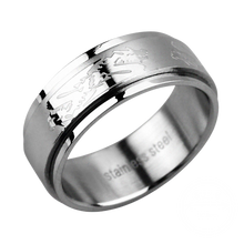 Load image into Gallery viewer, Silver steel spinner ring with engraved dragon design on a transparent background
