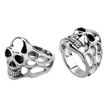 Load image into Gallery viewer, Two high polished stainless steel rings with a casted skull and smoke design, viewed from different angles.

