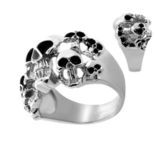 Load image into Gallery viewer, A silver-toned skull ring with black oxidized details, shown on a plain white background with a smaller inset view of the ring from a different angle.
