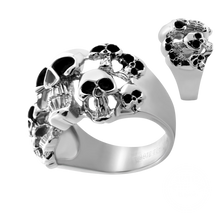 Load image into Gallery viewer, A silver-toned skull ring with black oxidized details, shown on a plain white background with a smaller inset view of the ring from a different angle.
