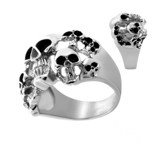 Load image into Gallery viewer, A silver-toned skull ring with black oxidized details, shown on a plain white background with a smaller inset view of the ring from a different angle.

