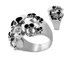 Load image into Gallery viewer, A silver-toned skull ring with black oxidized details, shown on a plain white background with a smaller inset view of the ring from a different angle.
