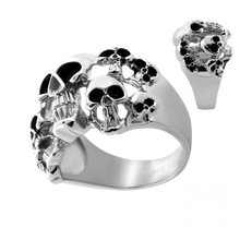 Load image into Gallery viewer, A silver-toned skull ring with black oxidized details, shown on a plain white background with a smaller inset view of the ring from a different angle.
