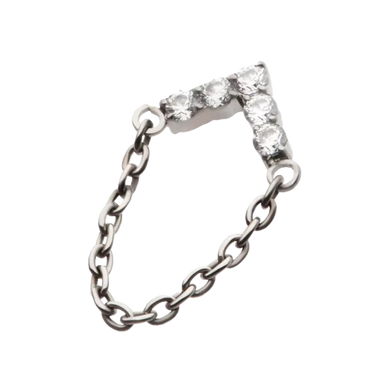 A titanium chevron-shaped body jewellery with a single connecting chain and threadless attachment.