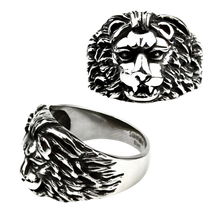 Load image into Gallery viewer, A stainless steel ring with a lion's face design, presented from two angles showing the profile and top view.
