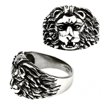 Load image into Gallery viewer, A stainless steel ring with a lion's face design, presented from two angles showing the profile and top view.
