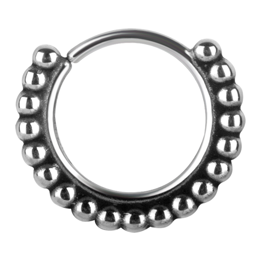 A continuous ring with a granulated tribal design, made from surgical steel.