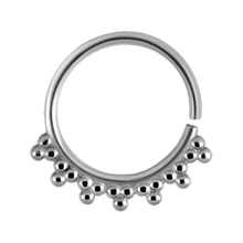 Load image into Gallery viewer, A surgical steel continuous ring with a granulated tribal design
