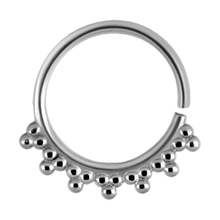 Load image into Gallery viewer, A surgical steel continuous ring with a granulated tribal design
