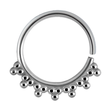 A surgical steel continuous ring with a granulated tribal design