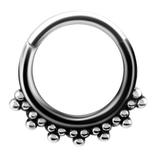 Load image into Gallery viewer, A steel tribal hinged ring with granulated details and a hinged center.
