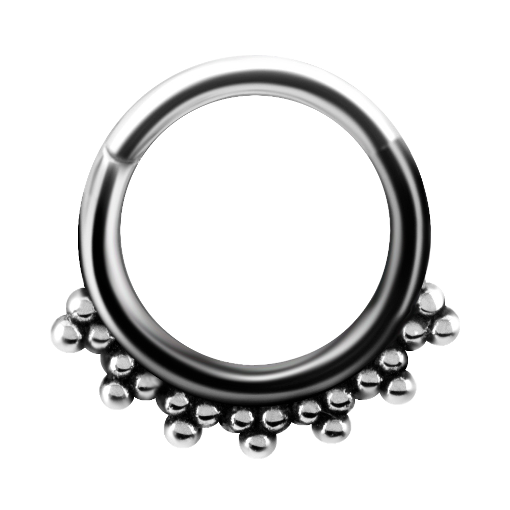 A steel tribal hinged ring with granulated details and a hinged center.