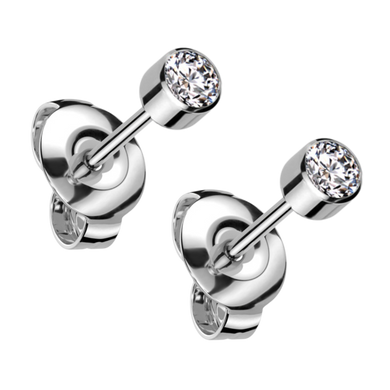 Pair of titanium ear studs with a 3mm white bezel-set cubic zirconia stones and titanium butterfly backs
