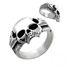 Load image into Gallery viewer, A high polished stainless steel ring with a skull and wings design, displayed from two different angles.

