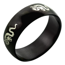 Load image into Gallery viewer, A black steel band ring with a engraved dragon design.
