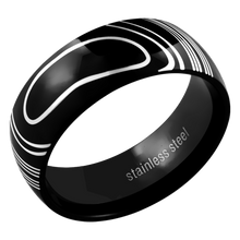 Load image into Gallery viewer, A black stainless steel ring with a white marble-like design, polished finish, and rounded edges.
