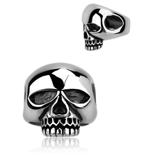Load image into Gallery viewer, A silver-coloured ring with a large skull design on the top, resembling the style of the famous rock star Keith Richards.
